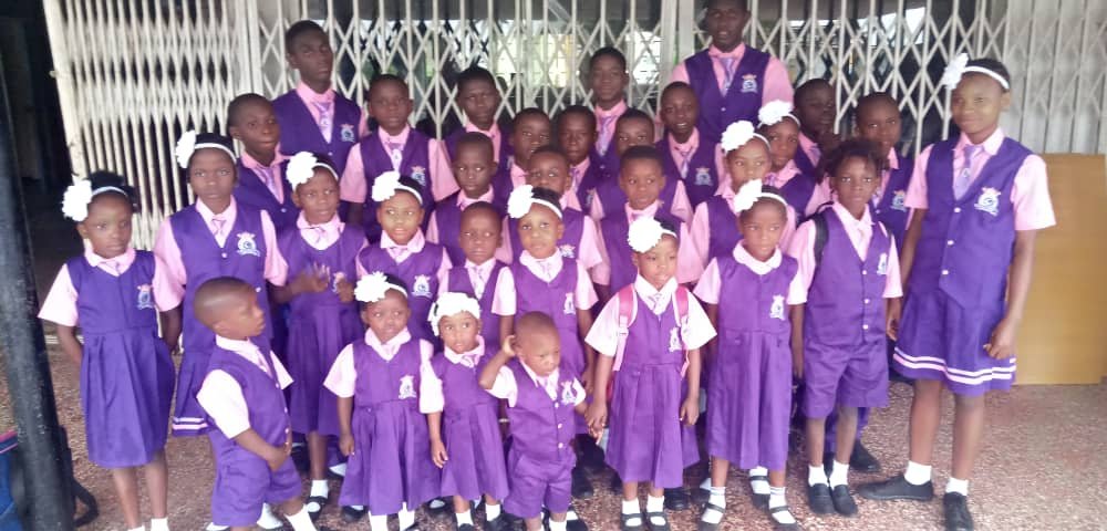 Pupils of the free orphan school in their purple uniforms