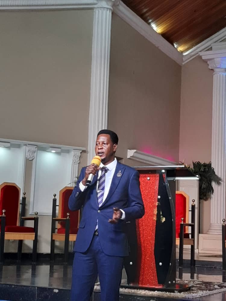 Founder of King's Heritage Missionary Home speaking at an event